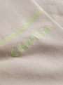 Calvin Klein FUTURE SHIFT Mens Lounge Joggers Satelite close-up detail view of logo with green stitching.