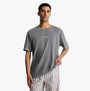 Calvin Klein FUTURE SHIFT Mens Lounge Crew Neck T-Shirt Grey front view on model with striped pants.