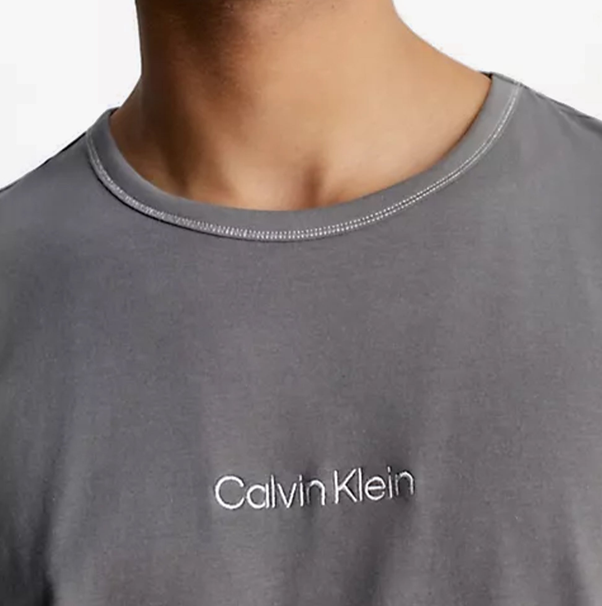 Calvin Klein FUTURE SHIFT Mens Lounge Crew Neck T-Shirt Grey detail view showing crew neckline and logo embroidery.