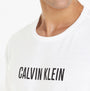 Calvin Klein INTENSE POWER Mens Crew Neck White close-up view showing logo print on chest and crew neckline.