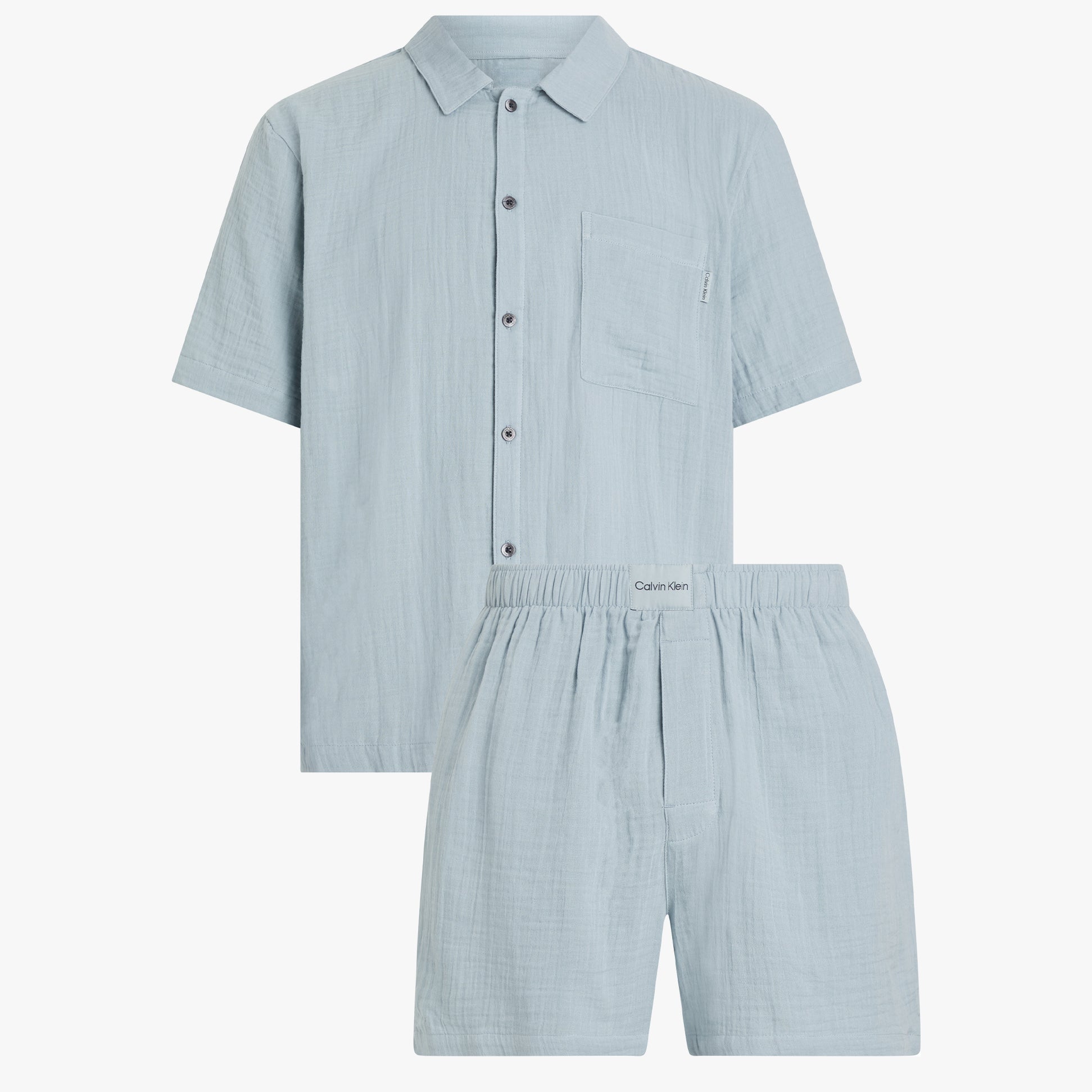 Calvin Klein SHORT SET Mens Arona front view, lightweight cotton short sleeve button-up shirt and shorts in light blue.