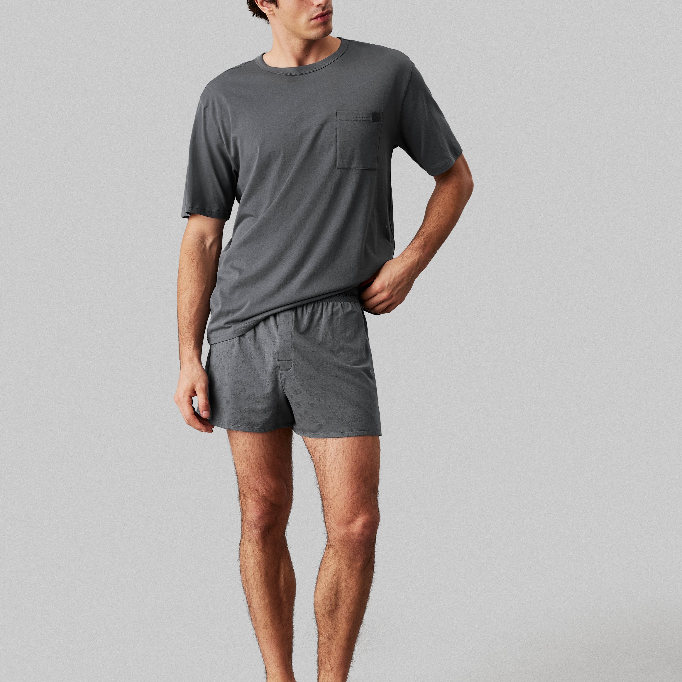 Calvin Klein MODERN COTTON VDAY Mens Boxer Set Turbulence front view showcasing grey short sleeve top and boxer shorts.