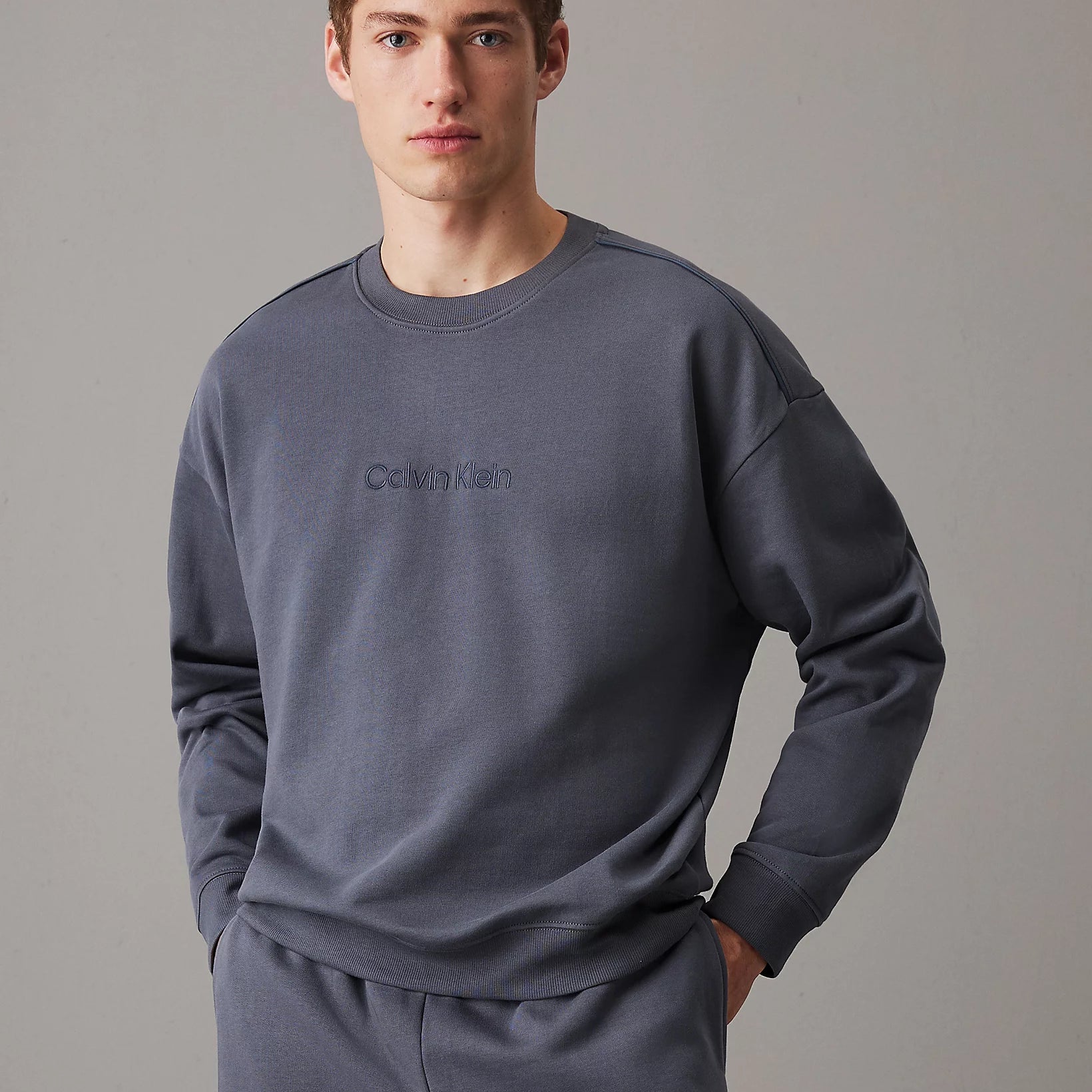 Calvin Klein COTTON FLEECE Mens Sweatshirt Turbulence / Ink front view on model detailing comfortable fit and style.