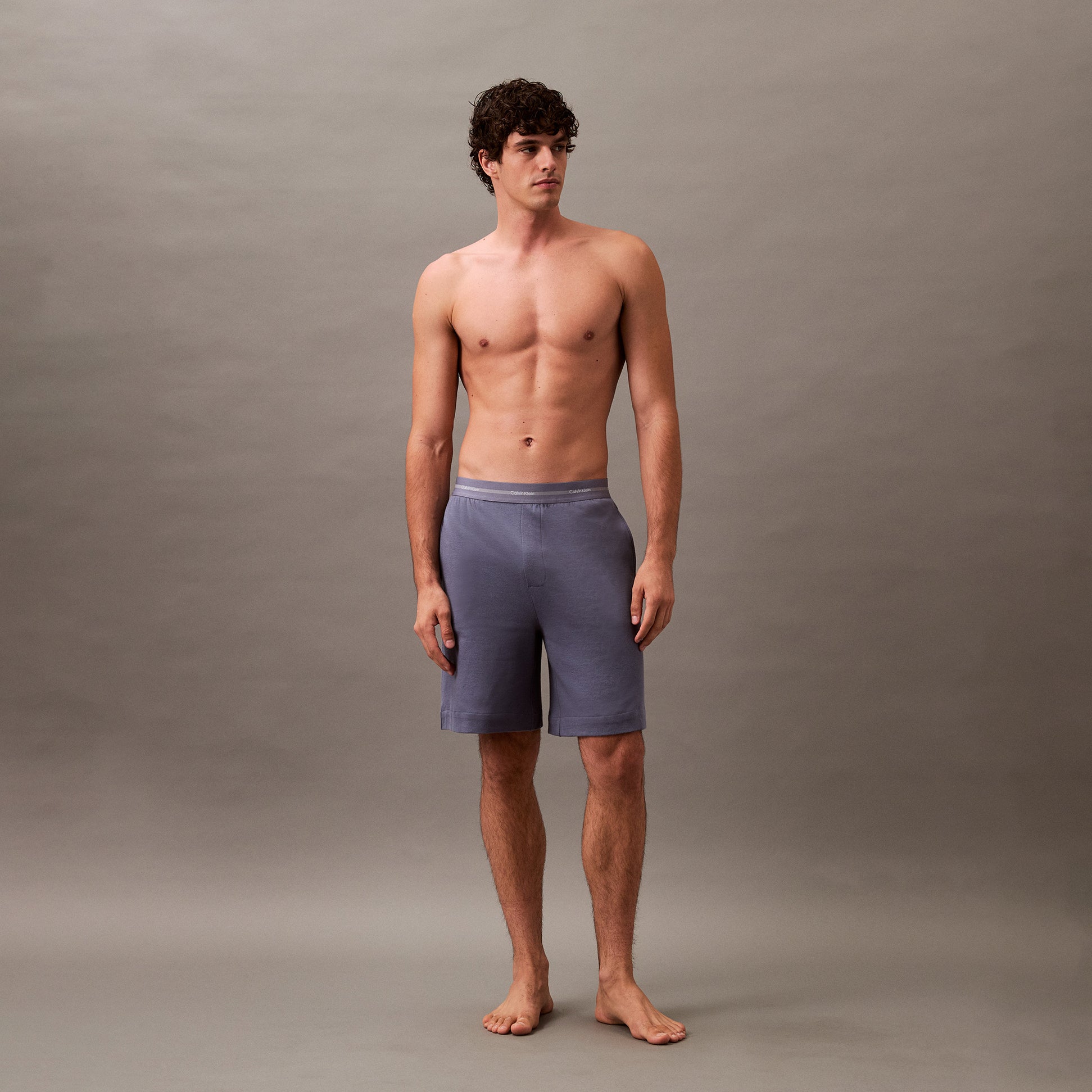 Calvin Klein SLEEP SHORT Mens Grisaille front view on model in breathable fabric, featuring elastic waistband and side seam pockets.