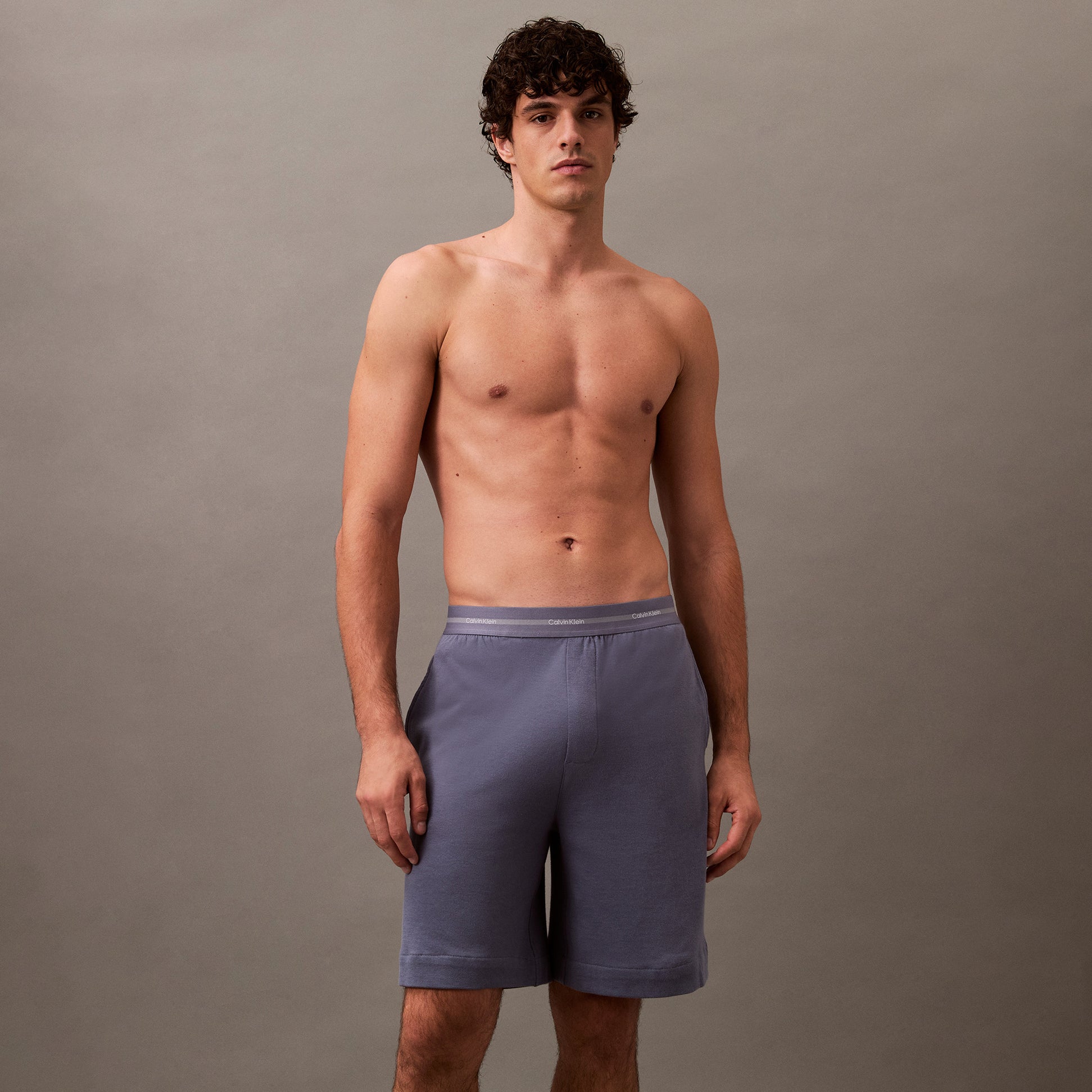 Calvin Klein SLEEP SHORT Mens Grisaille front view showing a model wearing comfortable shorts in breathable material.