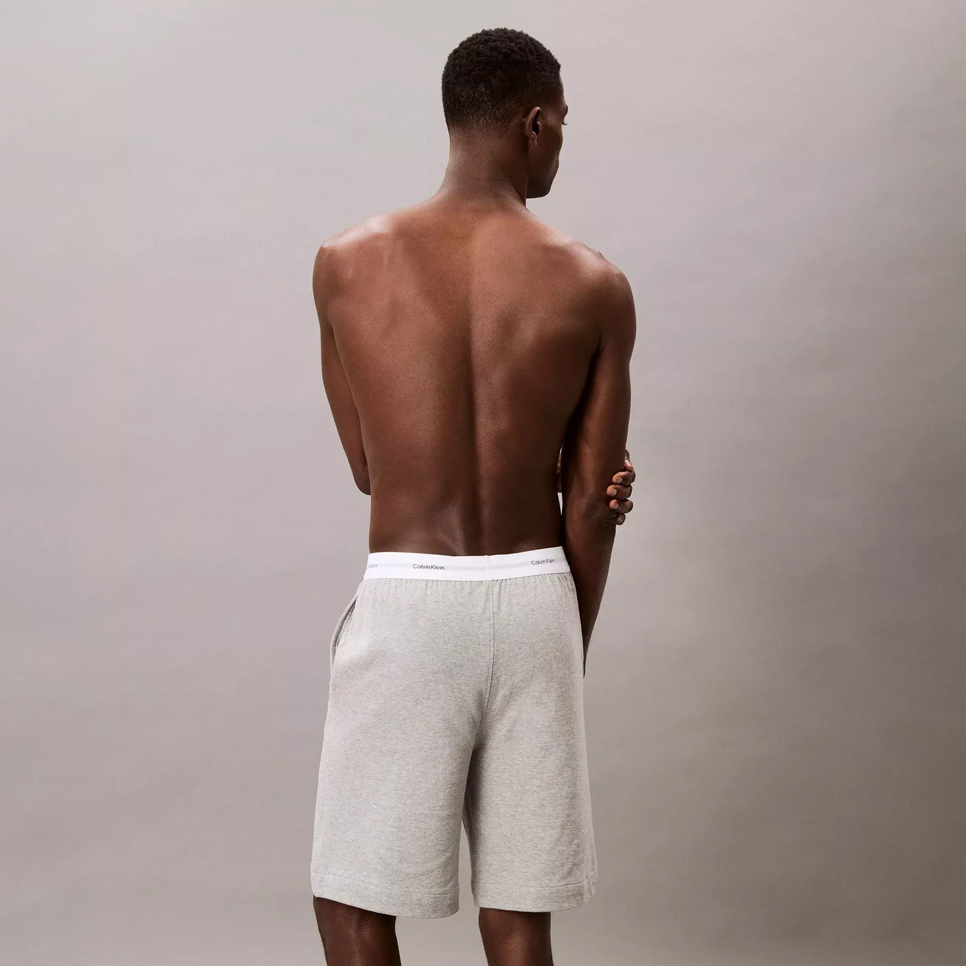 Calvin Klein SLEEP SHORT Mens Medium Grey Heather back view showing signature CK elastic waistband and side pockets.