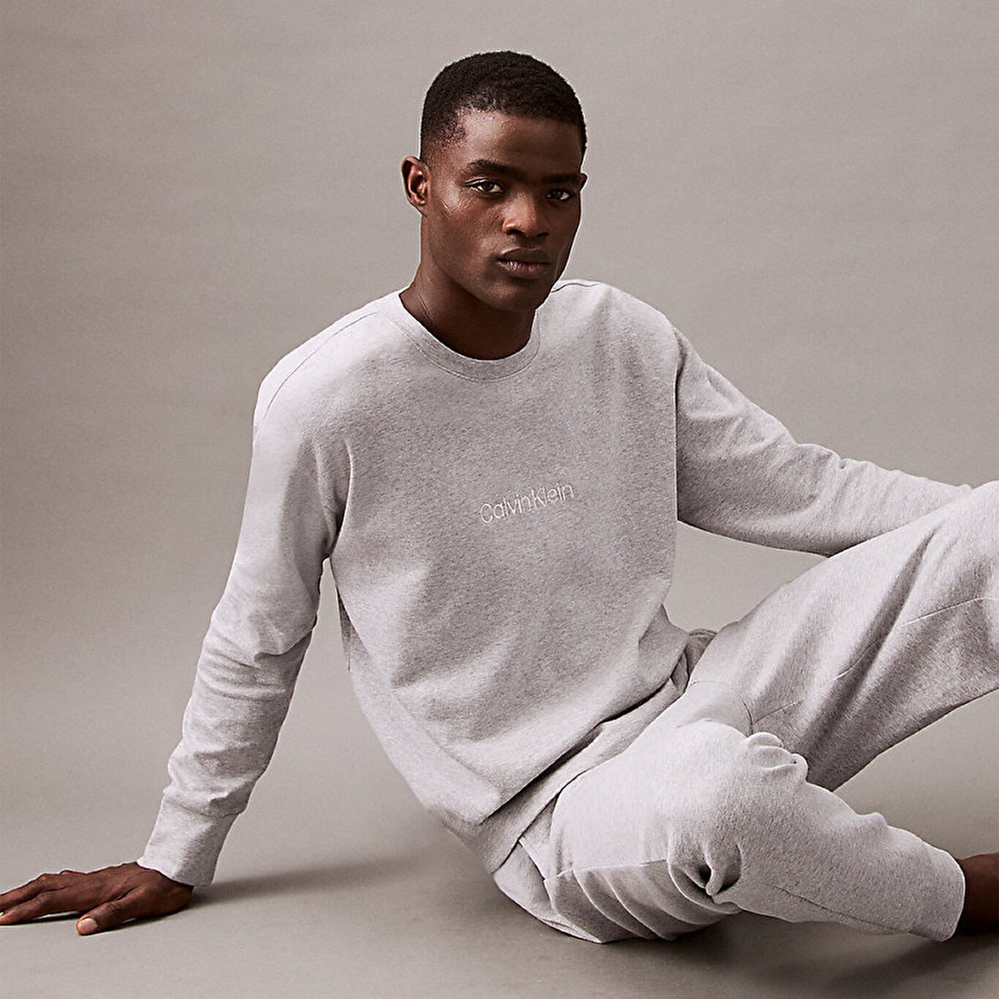 Calvin Klein ICON COTTON TERRY Mens Sweatshirt Medium Grey Heather front view, showing crew neckline and CK tonal embroidery.