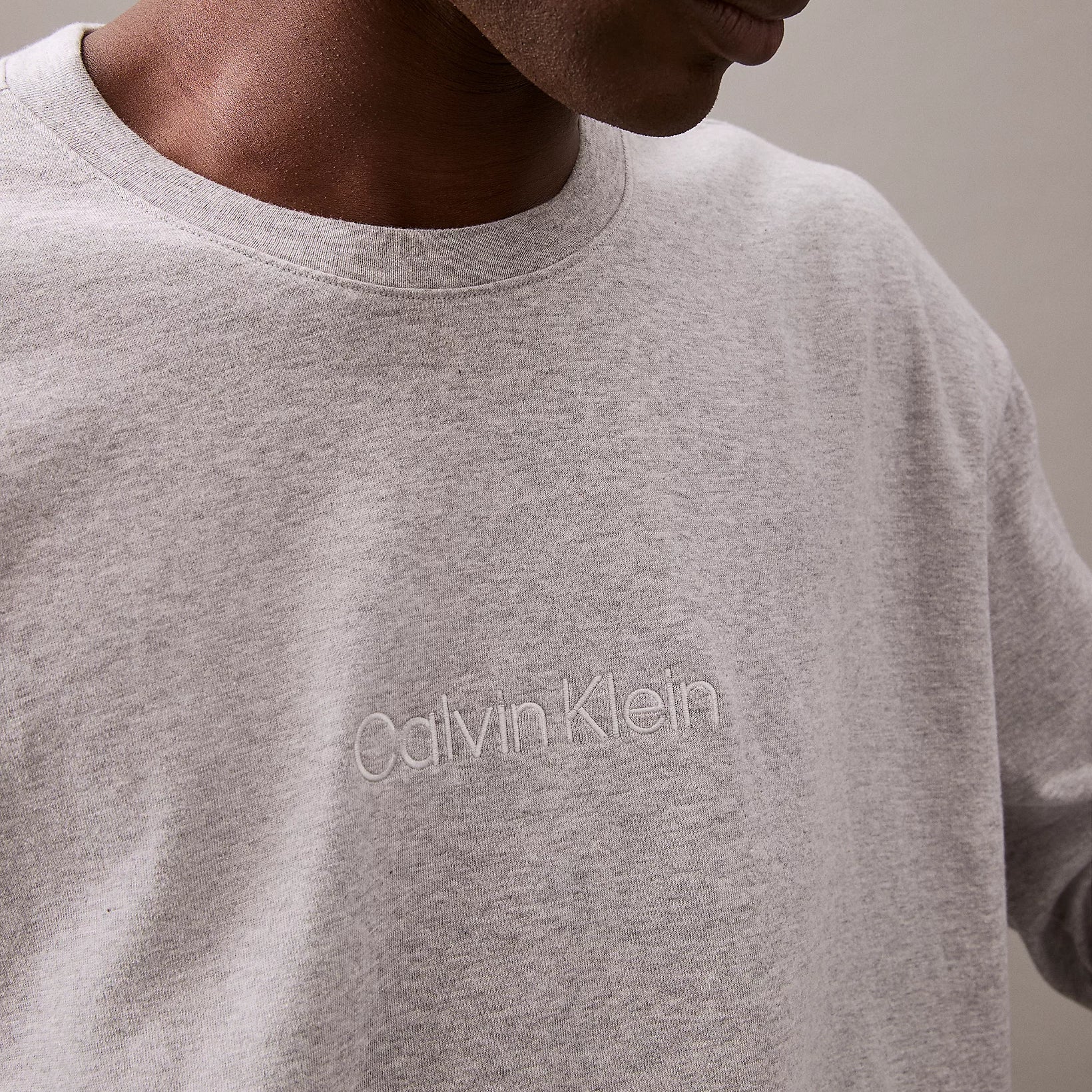 Calvin Klein MODERN TERRY Mens Sweatshirt Grey Heather close-up of logo detail on fabric