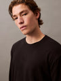 Calvin Klein MODERN TERRY Mens Sweatshirt Black front view on model, showcasing the minimalist design and comfort material.