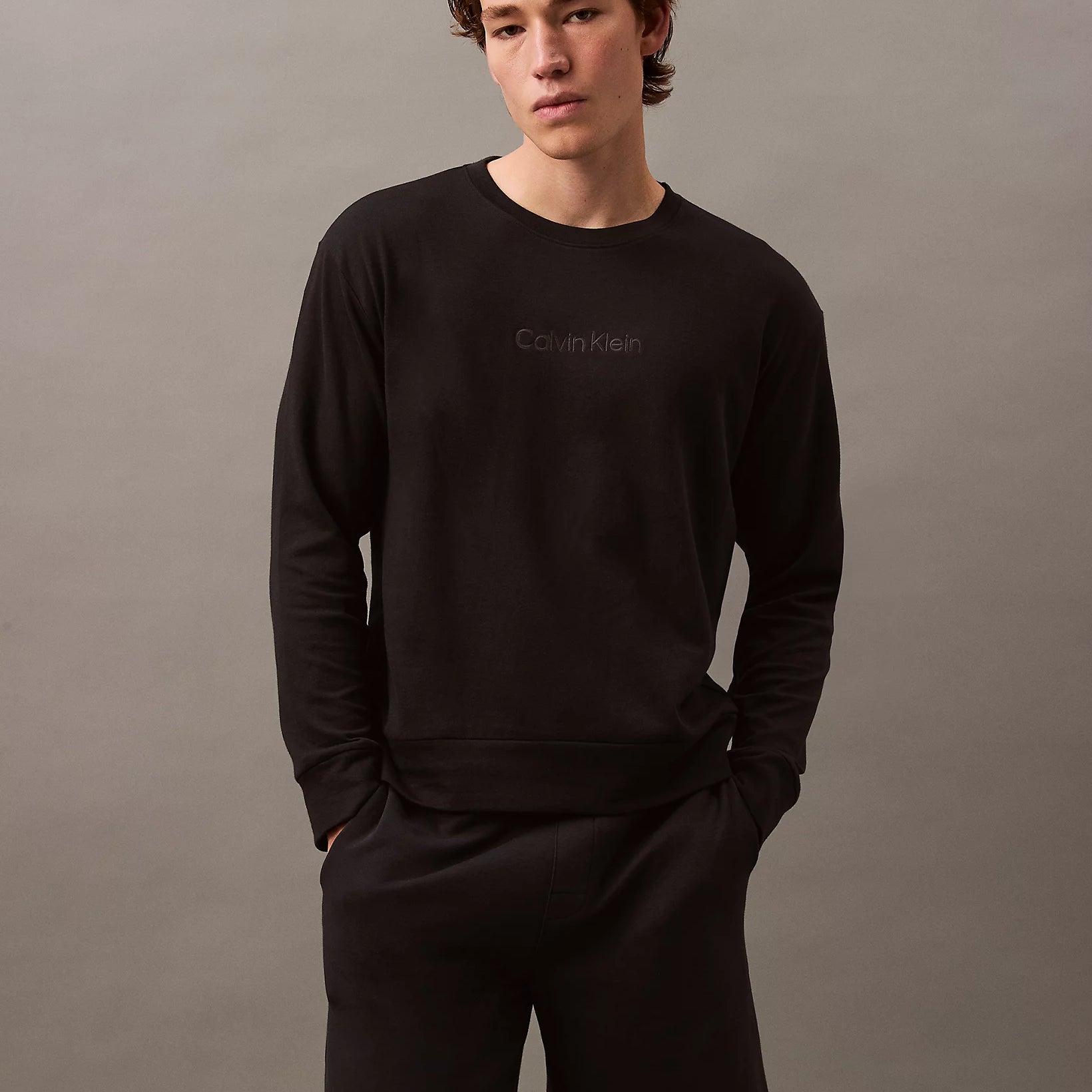 Calvin Klein MODERN TERRY Mens Sweatshirt Black front view worn by model with black shorts.