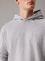 Calvin Klein ICON COTTON TERRY Mens Hoodie Grey close-up view showcasing soft fabric and logo detail.