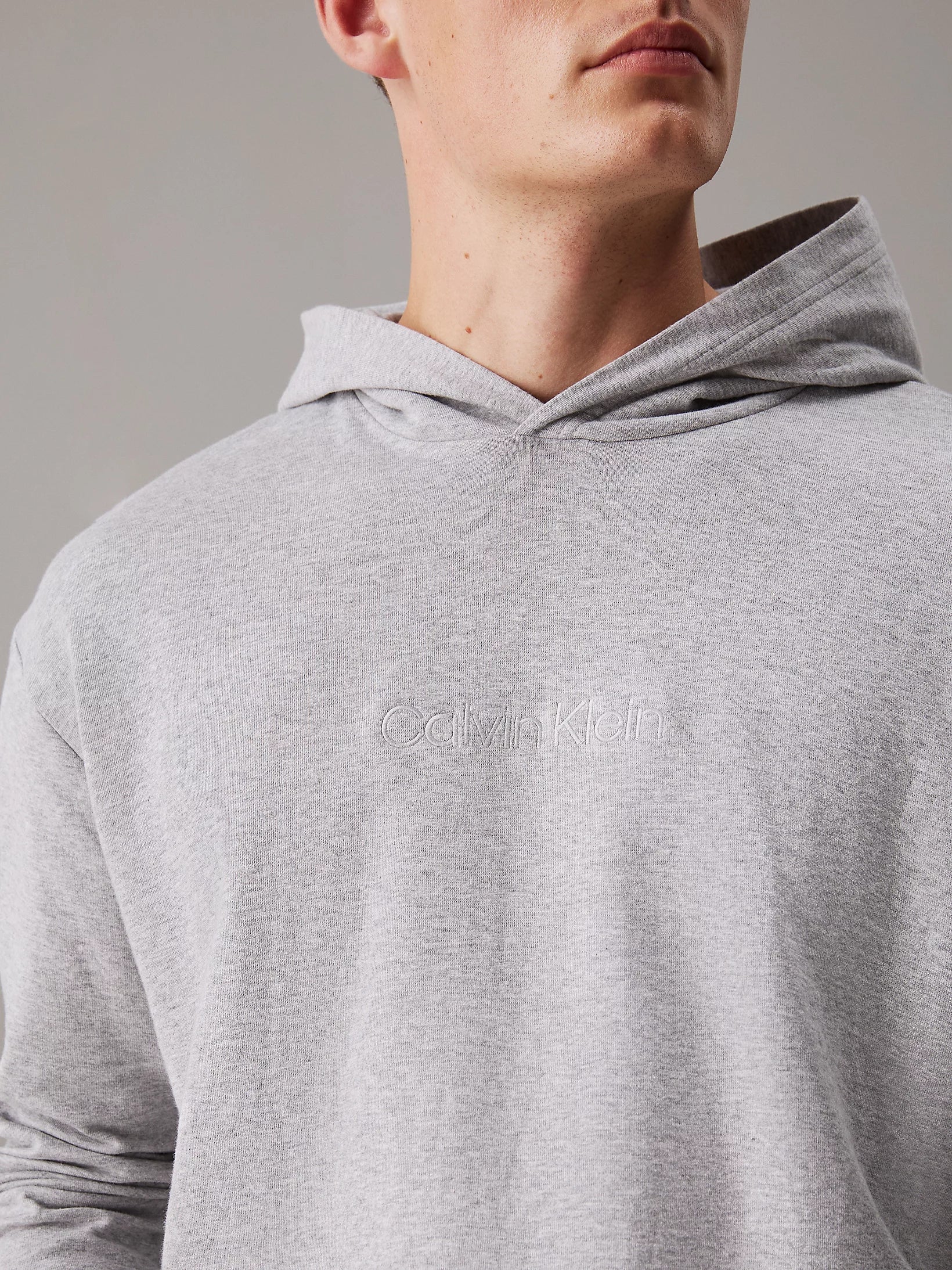 Calvin Klein ICON COTTON TERRY Mens Hoodie Grey close-up view showcasing soft fabric and logo detail.