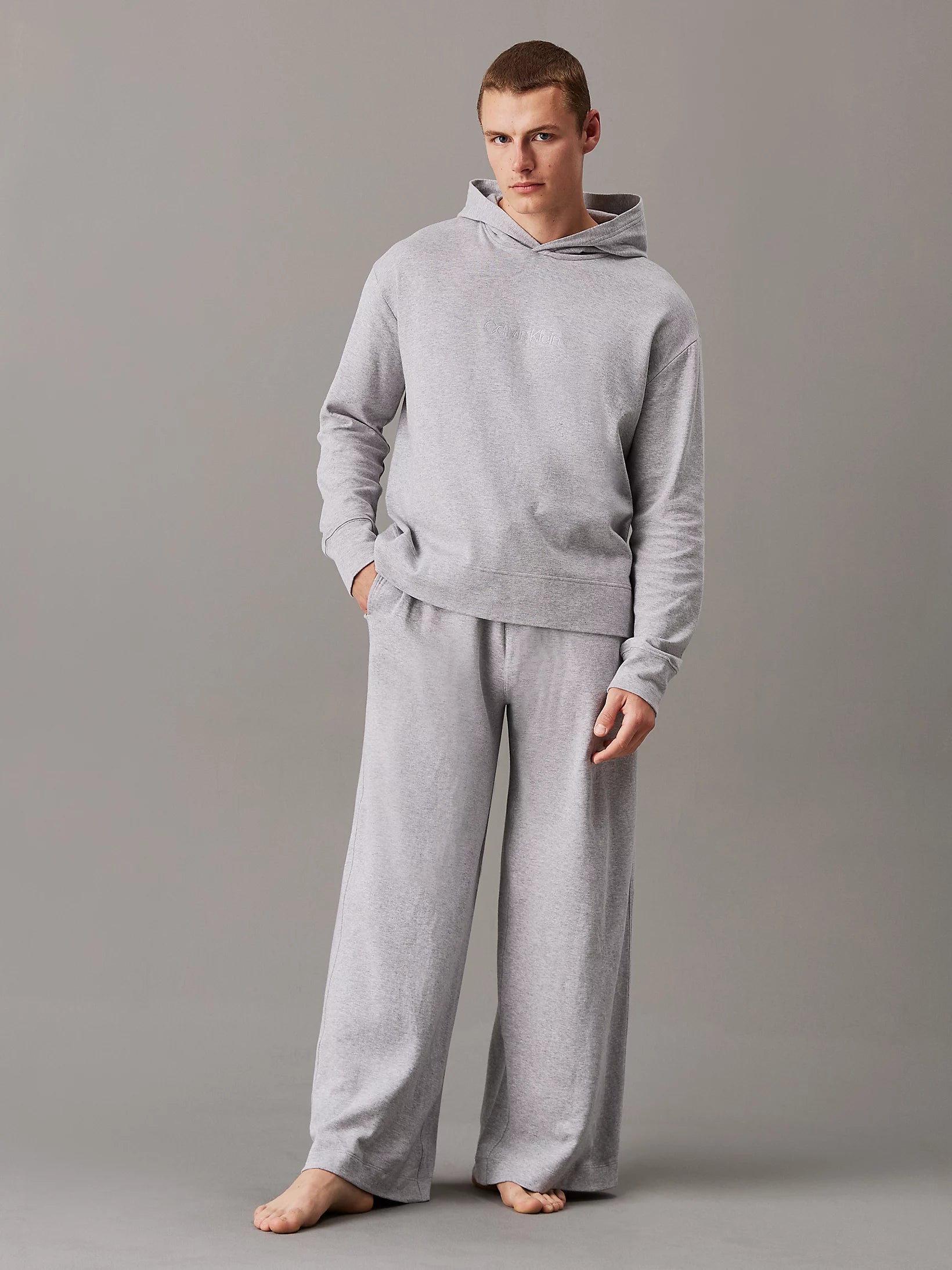 Calvin Klein ICON COTTON TERRY Mens Hoodie Grey shown in front view, paired with matching grey pants.