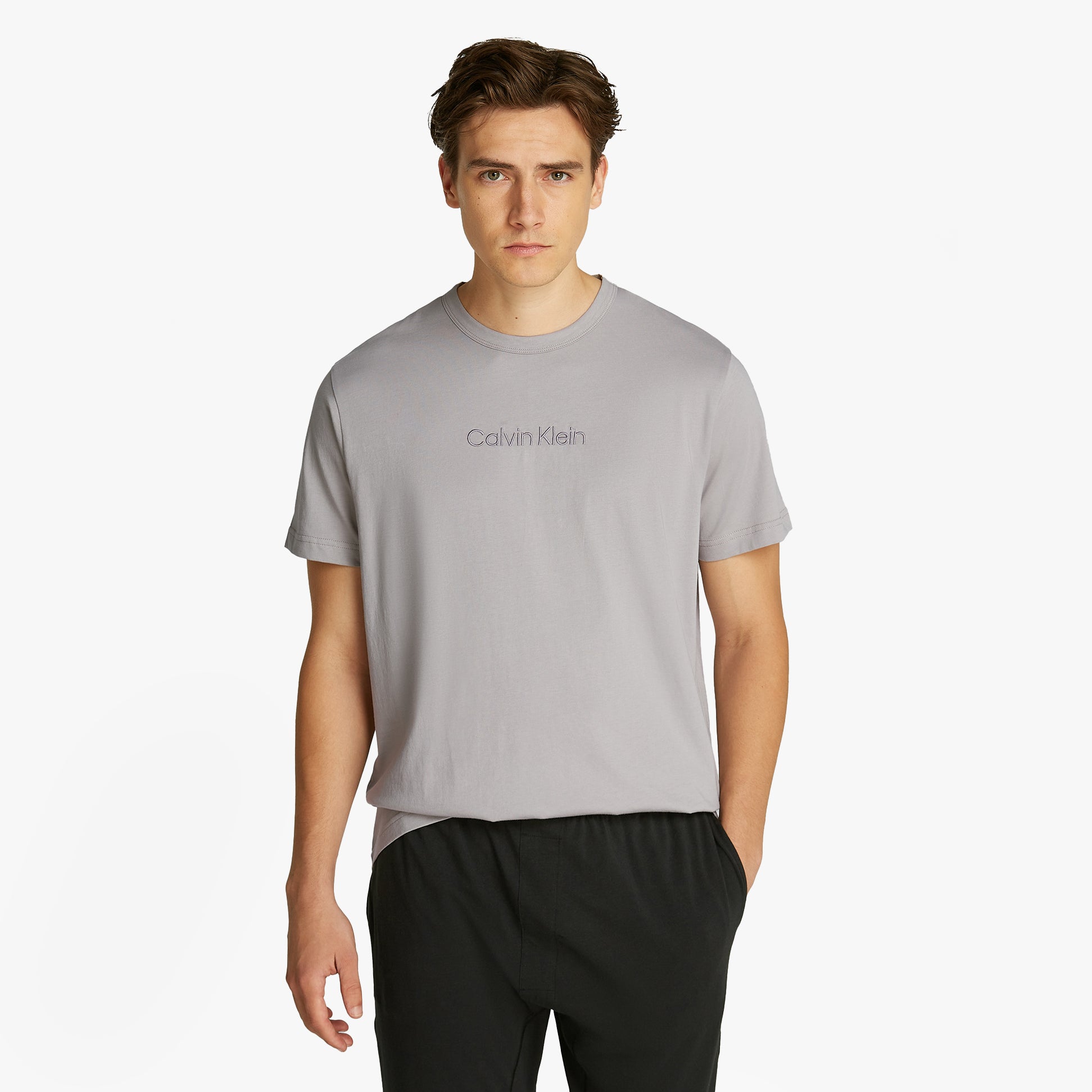 Calvin Klein 100% COTTON Mens Lounge T-Shirt Ash front view on model, showcasing crew neckline and short sleeves.