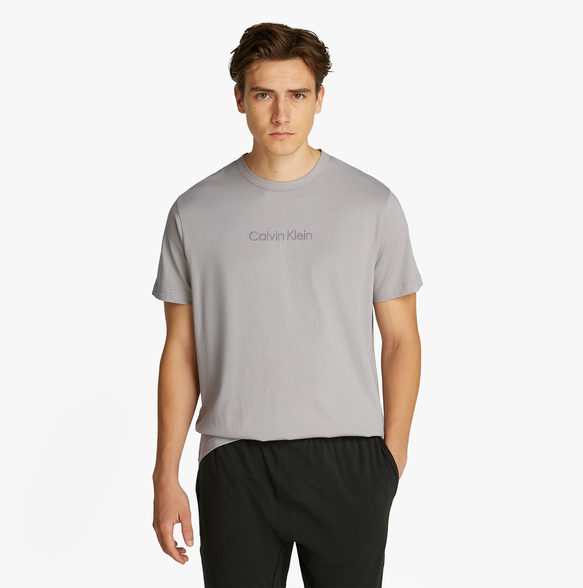 Calvin Klein 100% COTTON Mens Lounge T-Shirt Ash front view on model, showcasing crew neckline and short sleeves.