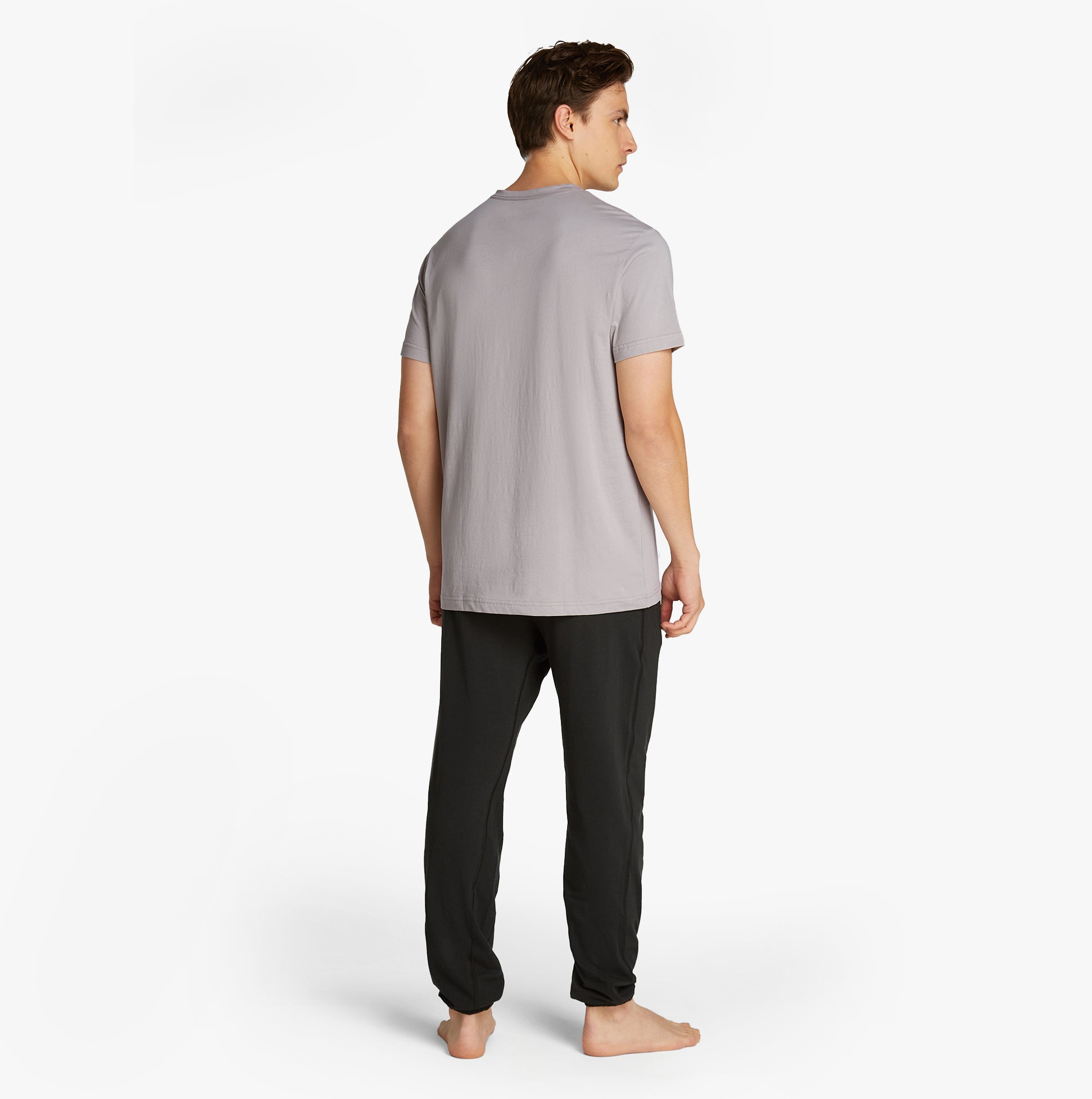 Calvin Klein 100% COTTON Mens Lounge T-Shirt Ash back view model wearing with black pants.