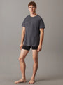 Calvin Klein LOGO COTTON Mens Crew Neck T Shirt Dark Grey Heather front view model wearing the shirt with black shorts.
