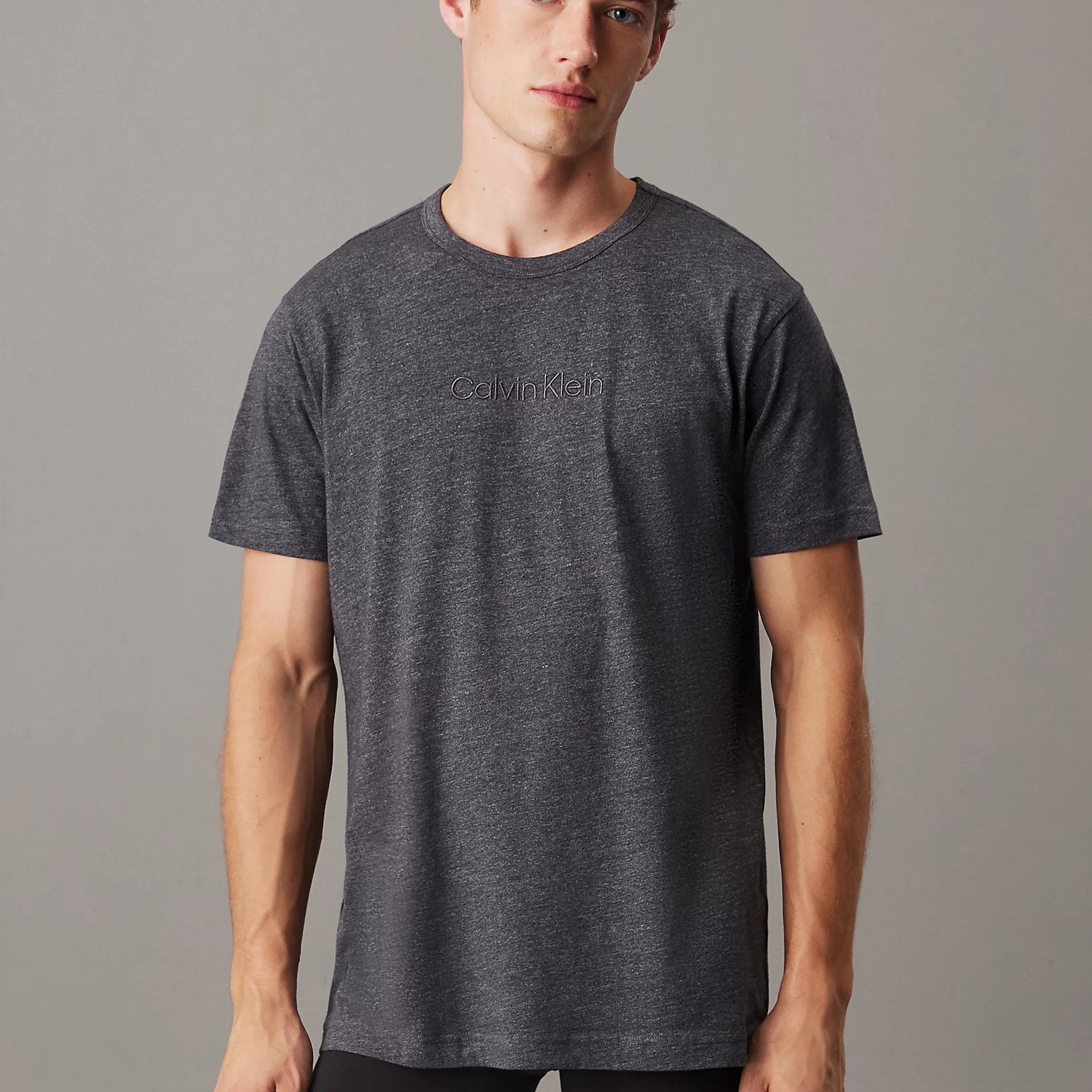 Calvin Klein LOGO COTTON Mens Crew Neck T Shirt Dark Grey Heather front view on model, showcasing matching chest logo.
