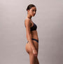 Calvin Klein Womens Invisible 3 Pack Thong Multi side view model wearing navy thong underwear