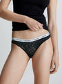 Calvin Klein LACE BIKINI Womens Bried Black side view on model showcasing semi-sheer leopard lace and CK signature waistband.