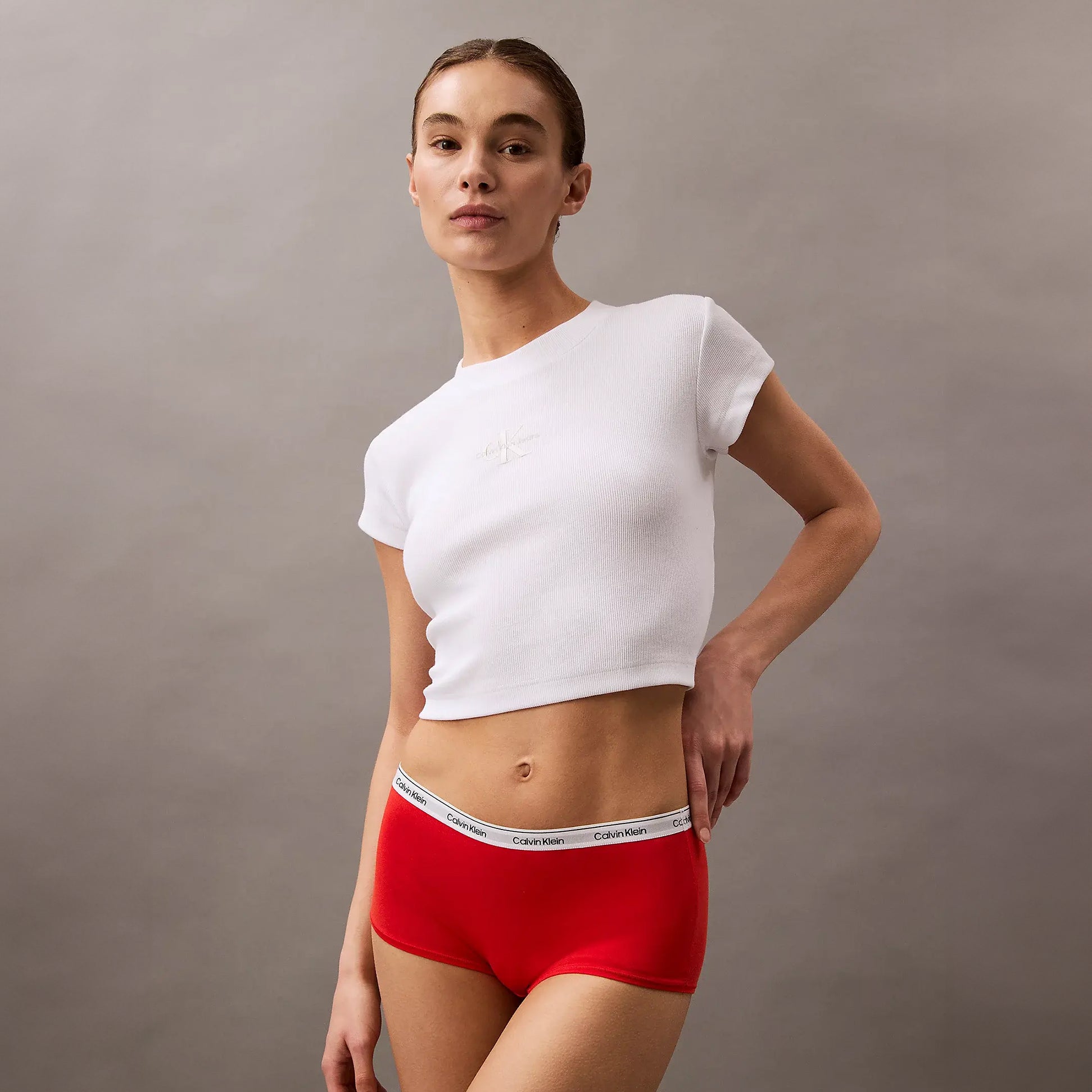 Calvin Klein ICON LOGO Hipster Panty Womens Shorts Molten side view worn by model with white crop top.