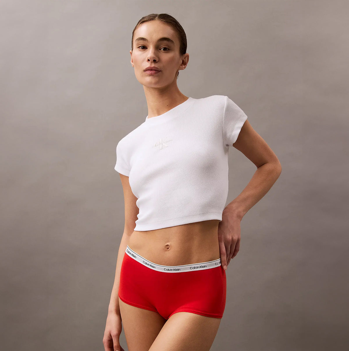 Calvin Klein ICON LOGO Hipster Panty Womens Shorts Molten side view worn by model with white crop top.