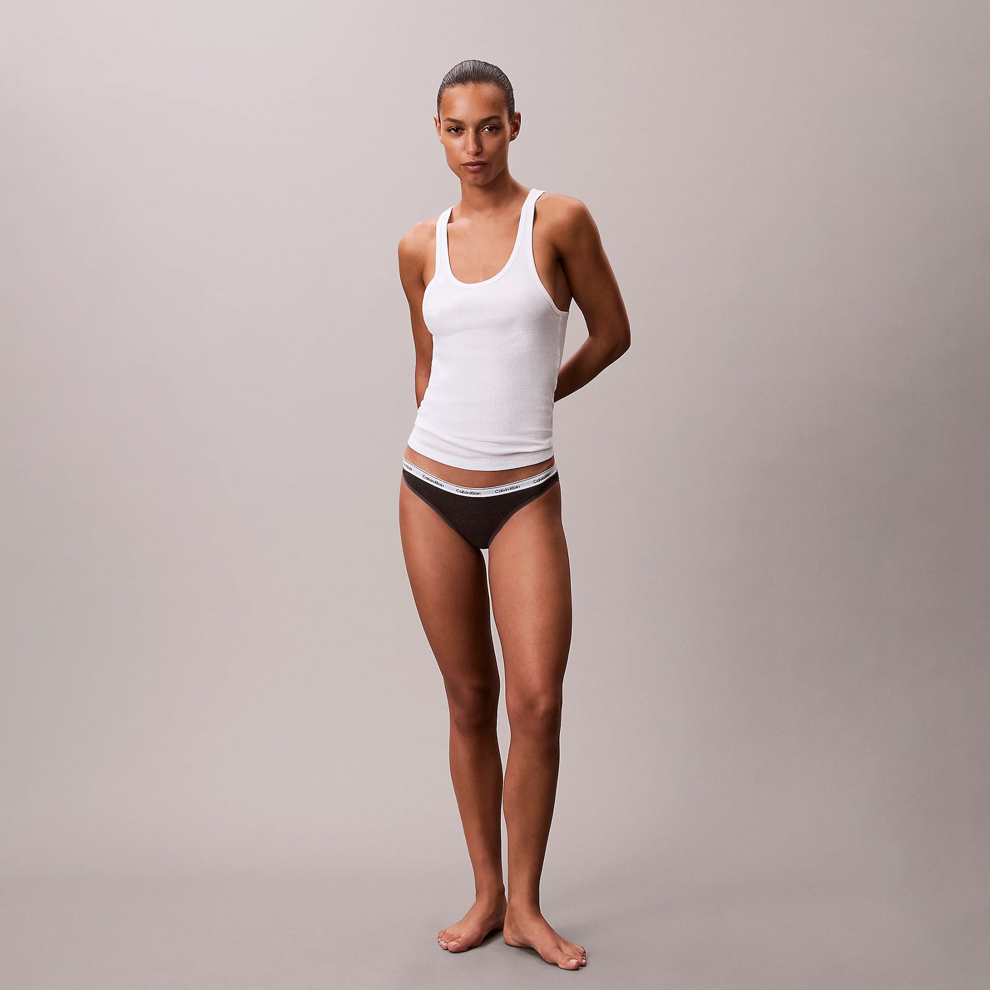 Calvin Klein 000QD5207E BIKINI 3 PACK Womens Briefs Multicoloured front view on model wearing white tank top.