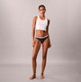 Calvin Klein THONG 3 PACK Womens Thong Multicoloured side view model wearing a white crop top and dark thong.
