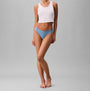 Calvin Klein BRAZILIAN 3 PACK Womens Multicoloured, front view model wearing blue underwear and pink crop top.