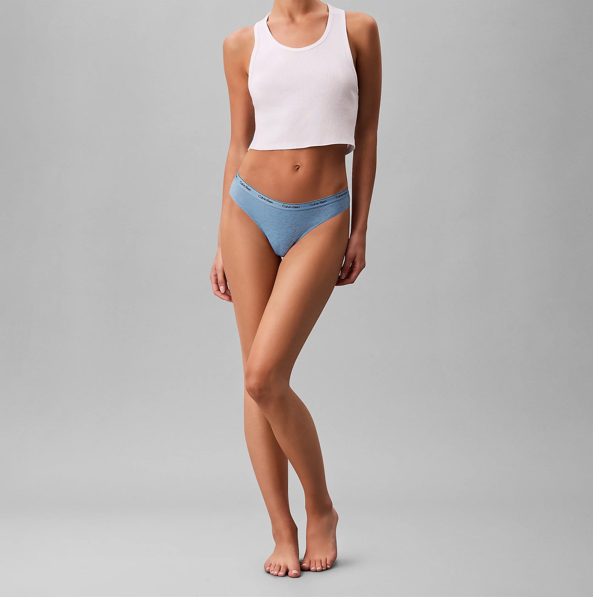 Calvin Klein BRAZILIAN 3 PACK Womens Multicoloured, front view model wearing blue underwear and pink crop top.