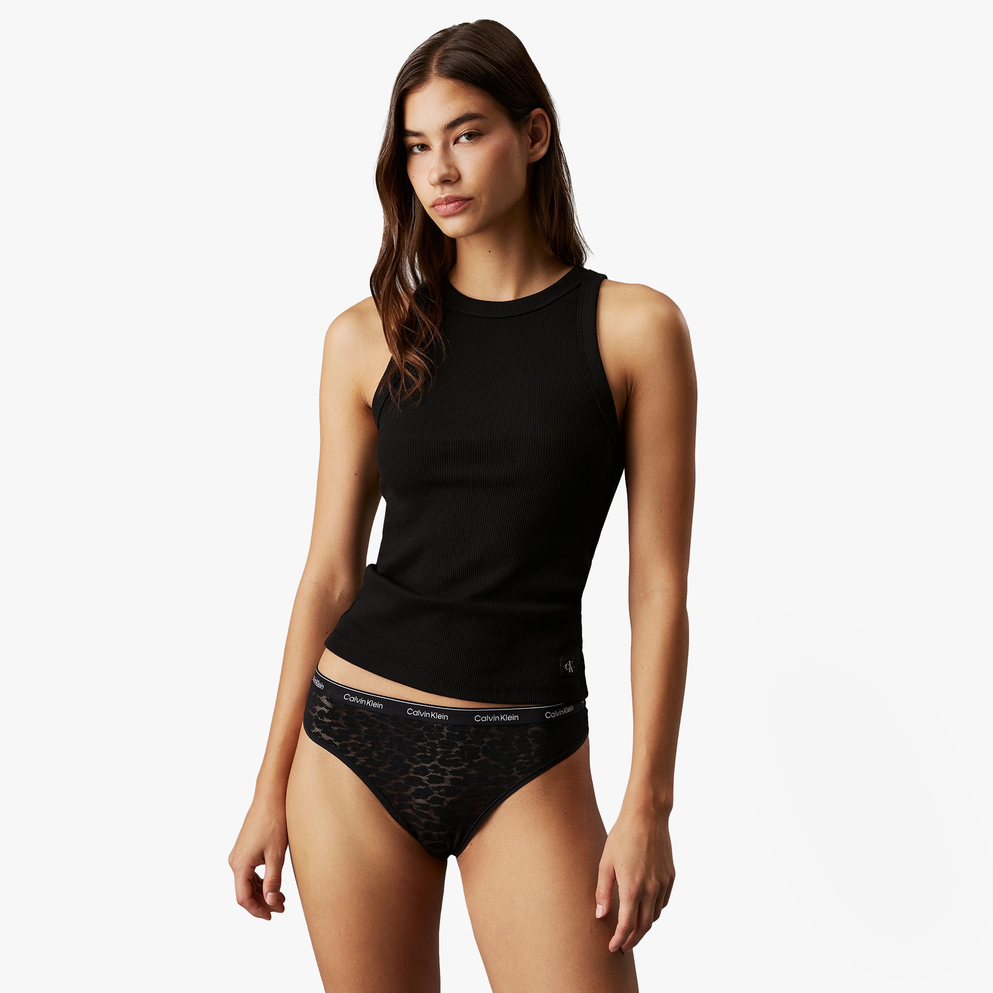 Calvin Klein BRAZILIAN LACE 3 Pack Womens Briefs Black side view on model, showcasing semi-sheer lace and elastic waistband.