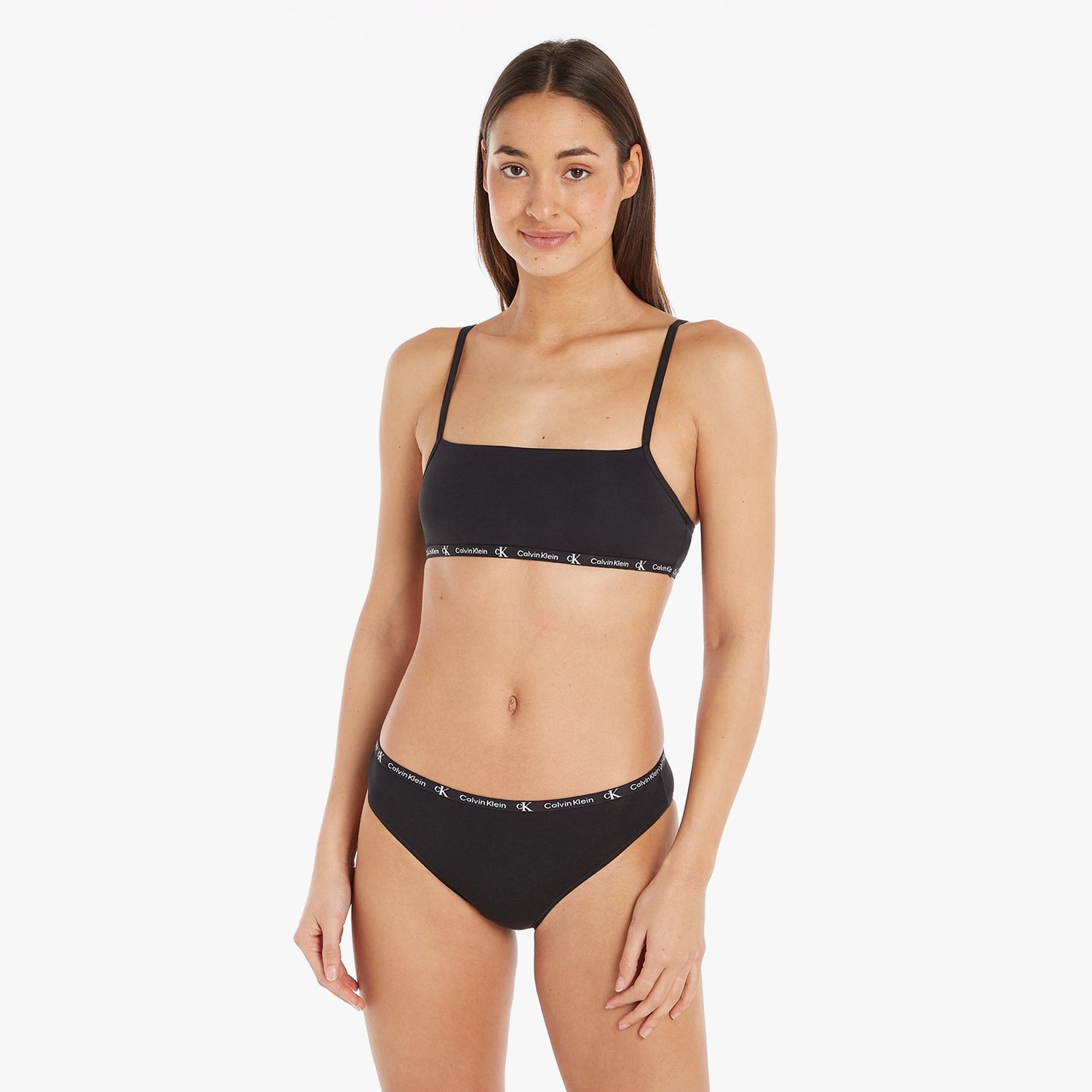 Calvin Klein 1996 COTTON 2 Pack Unlined Bralette Womens Black/Tiger Print front view on model, featuring adjustable straps.