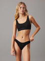 Calvin Klein UNLINED BRALETTE UB1 Womens Bra Black front view, featuring soft cups and adjustable straps.