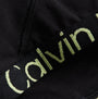 Calvin Klein UNLINED BRALETTE Womens Black Sunny Lime close-up detail view of bralette's strap and fabric.