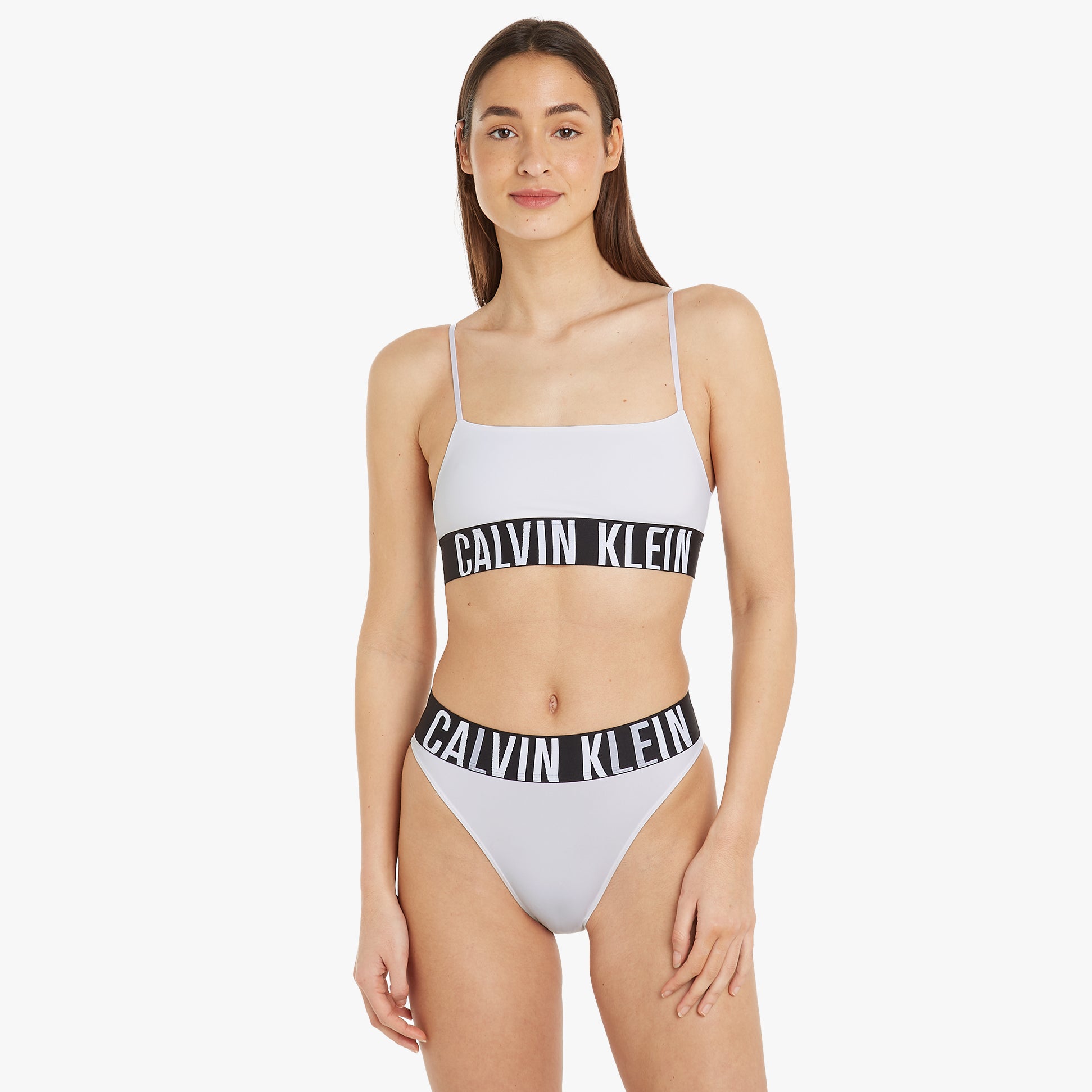 Calvin Klein INTENSE POWER Unlined Bralette Womens White front view showcasing adjustable straps and classic elastic underband.