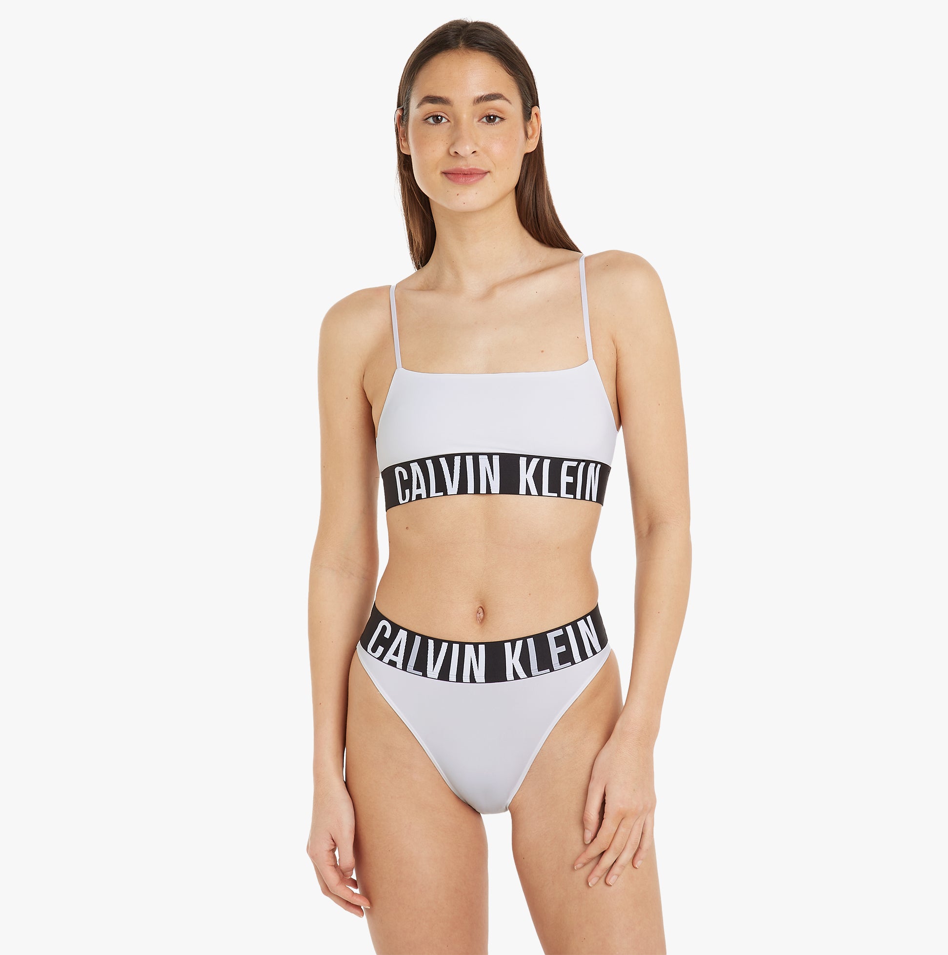 Calvin Klein INTENSE POWER Unlined Bralette Womens White front view showcasing adjustable straps and classic elastic underband.