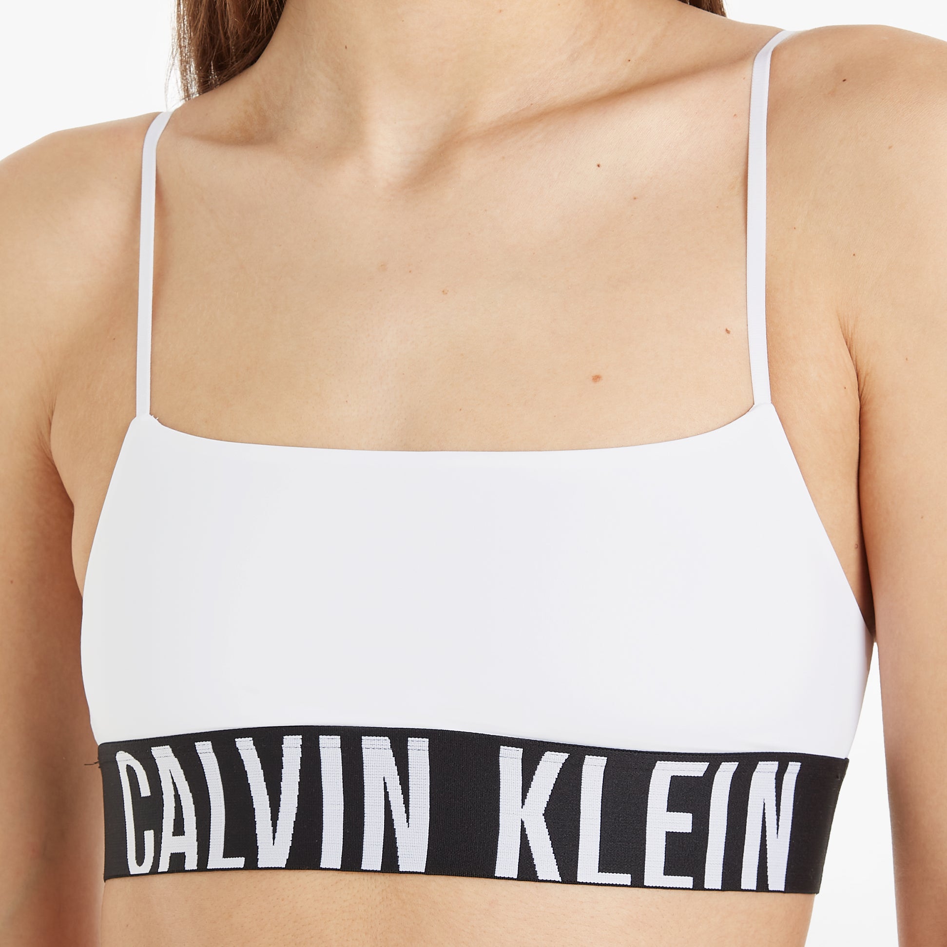 Calvin Klein INTENSE POWER Unlined Bralette Womens White front view showcasing the classic design and elastic underband.