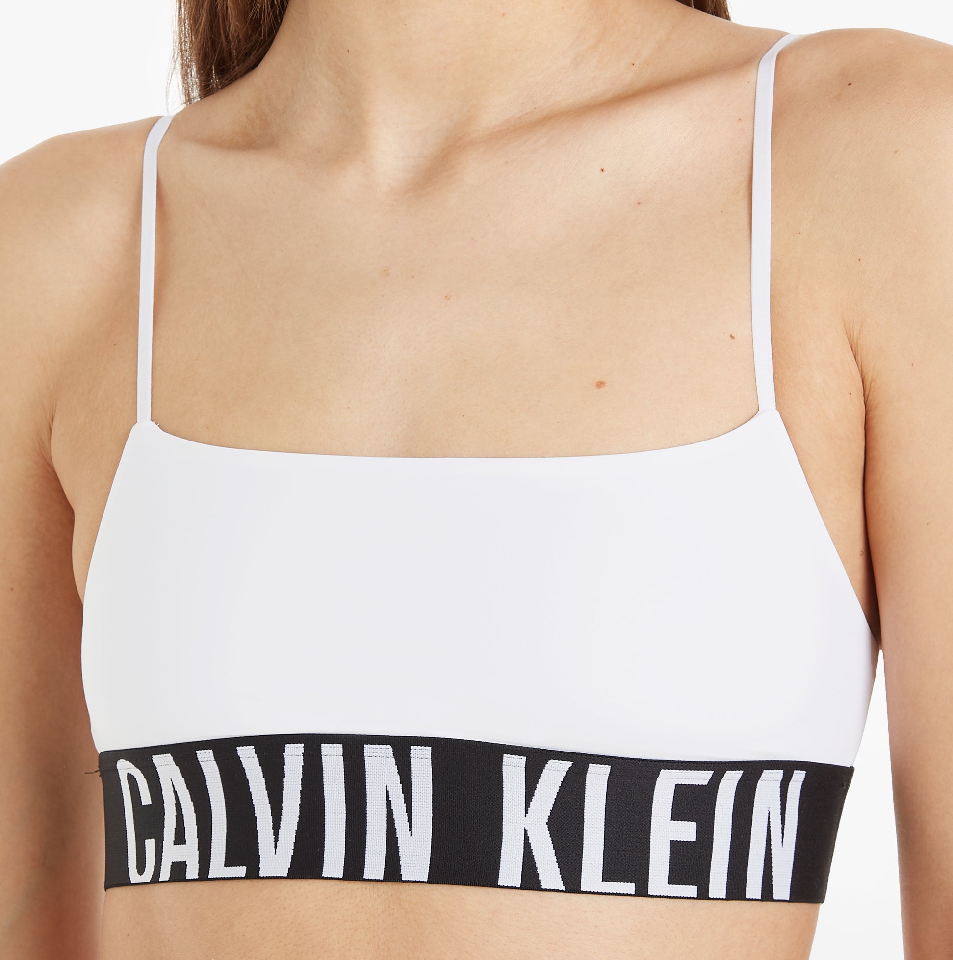 Calvin Klein INTENSE POWER Unlined Bralette Womens White front view showcasing the classic design and elastic underband.