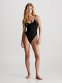 Calvin Klein INTENSE POWER Bodysuit Womens Black front view showcasing soft cups, double shoulder straps, and thong silhouette.
