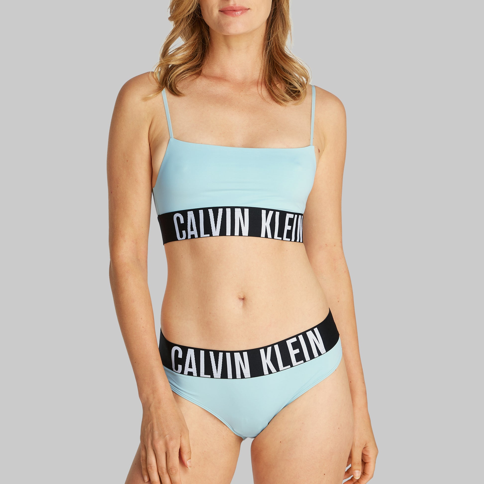 Calvin Klein INTENSE POWER Womens Bikini Briefs Ether, front view showing light blue color and CK signature waistband.