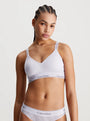 Calvin Klein MODERN LACE Lined Bralette Womens Lavender Blue front view on model showcasing soft moulded cups and adjustable straps.