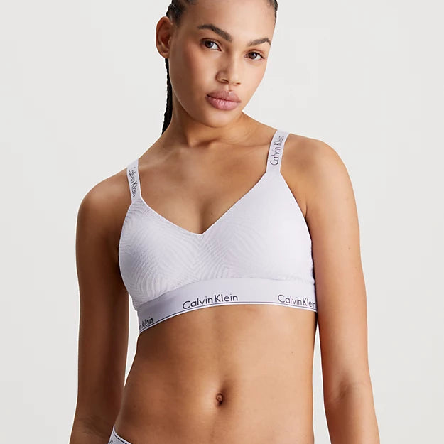 Calvin Klein MODERN LACE Lined Bralette Womens Lavender Blue front view on model showcasing soft moulded cups and adjustable straps.