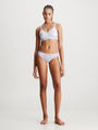 Calvin Klein MODERN LACE Lined Bralette Womens Lavender Blue front view on model, showcasing semi-sheer lace, soft moulded cups.