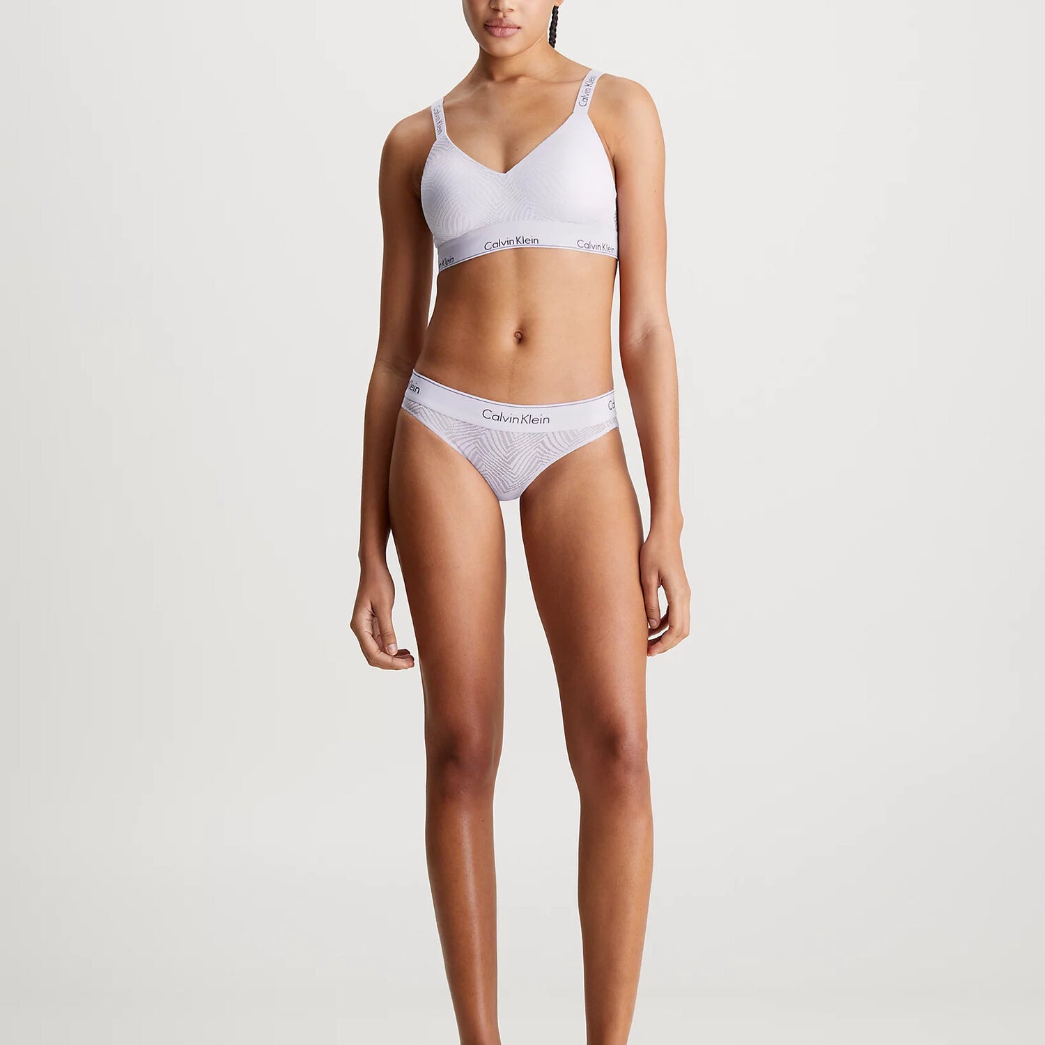 Calvin Klein MODERN LACE Lined Bralette Womens Lavender Blue front view on model, showcasing semi-sheer lace, soft moulded cups.