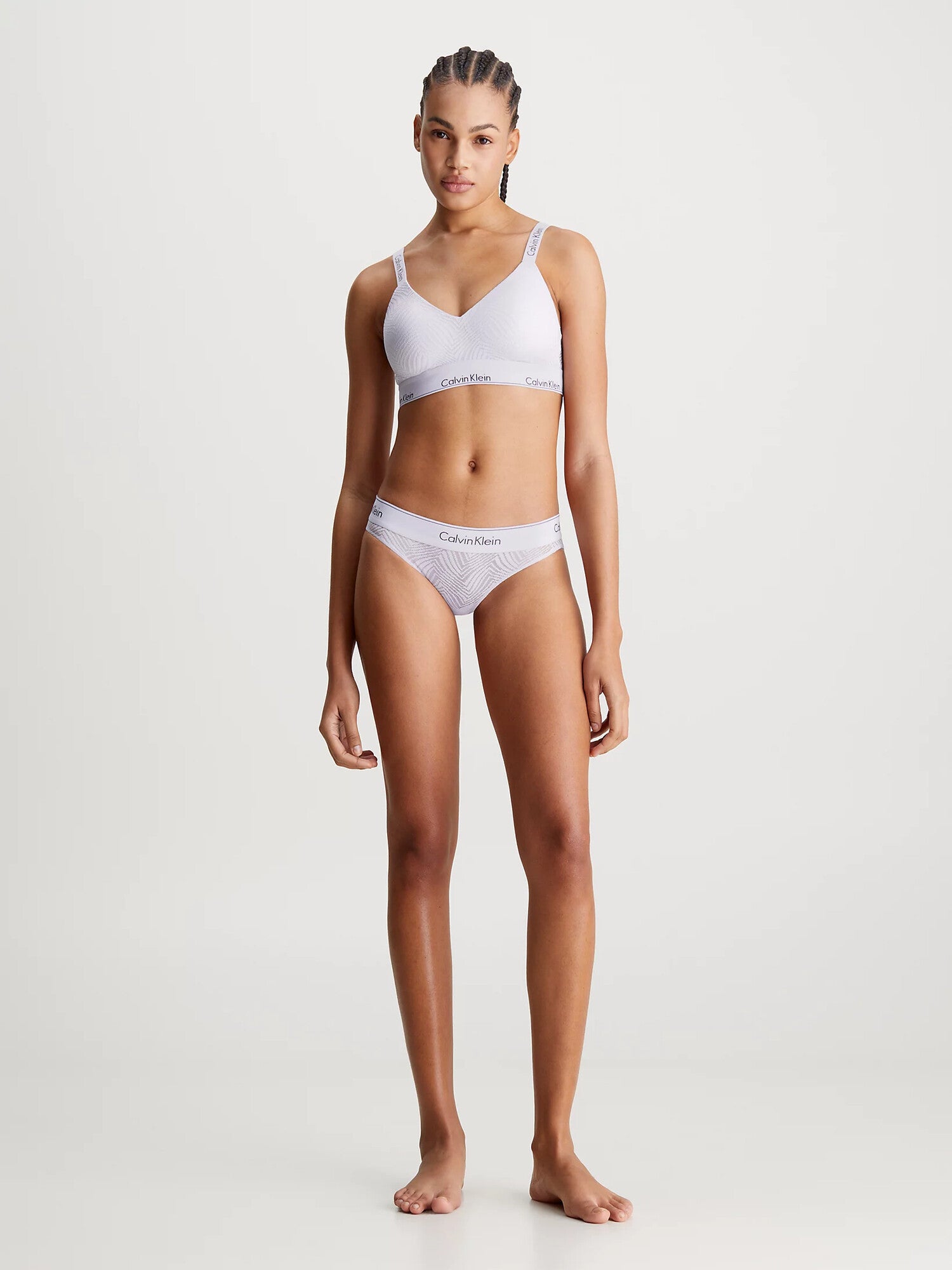 Calvin Klein MODERN LACE Lined Bralette Womens Lavender Blue front view on model, showcasing semi-sheer lace, soft moulded cups.