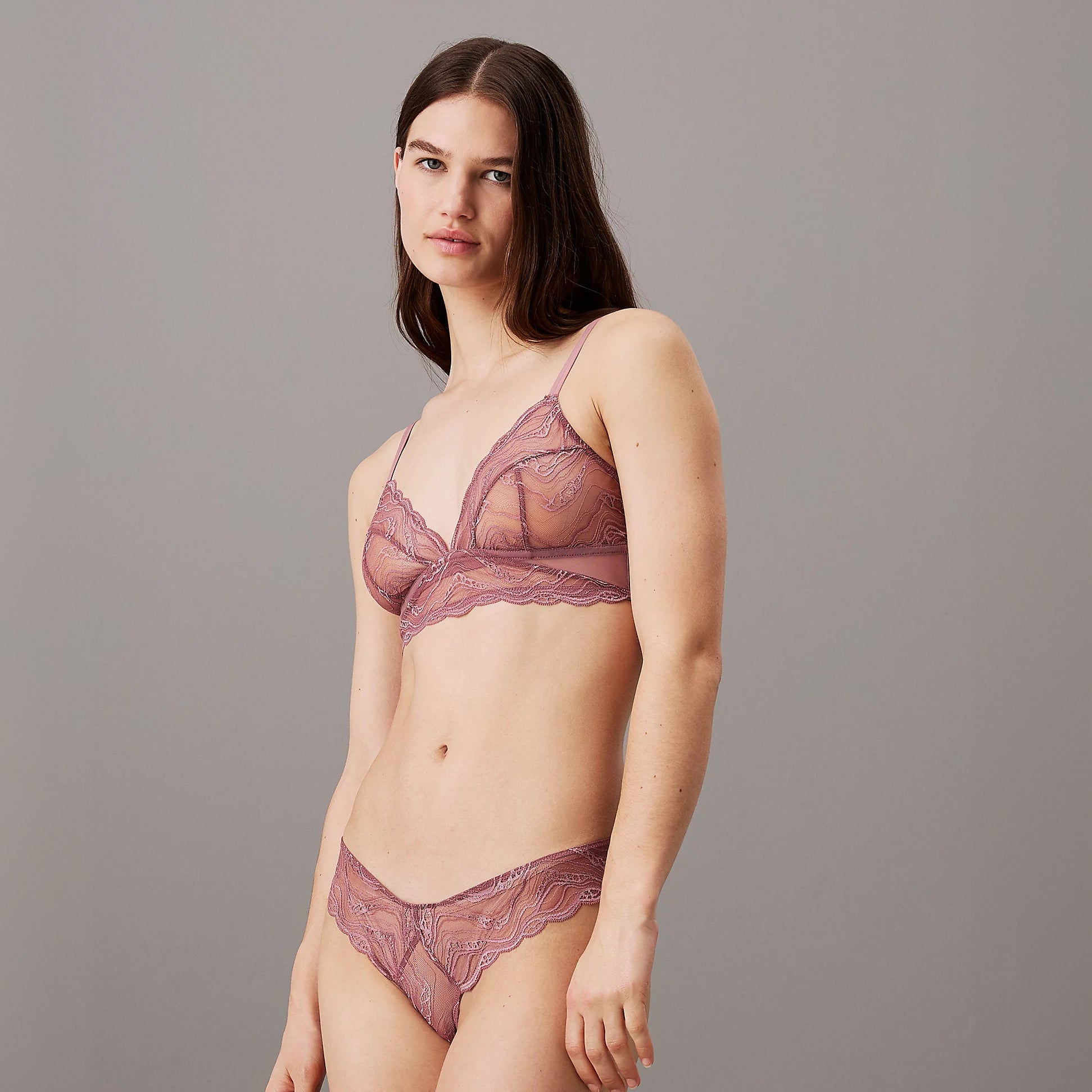 Calvin Klein CK INSTINCT Womens Unlined Triangle Vintage Pink front view on model showcasing the delicate lace design.