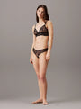 Calvin Klein CK INSTINCT Womens Triangle Bra Black side view on model with matching black lingerie set.