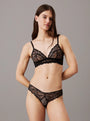 Calvin Klein CK INSTINCT Womens Triangle Bra Black front view on model with matching lace thong.