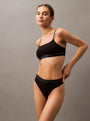 Calvin Klein TONAL LOGO COTTON Womens Thong Black front view model wearing black thong and matching bralette