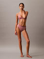 Calvin Klein TONAL LOGO COTTON Womens Thong Red Grape W/ Apple Butter Logo front view on model, showcasing a stylish and comfortable fit.
